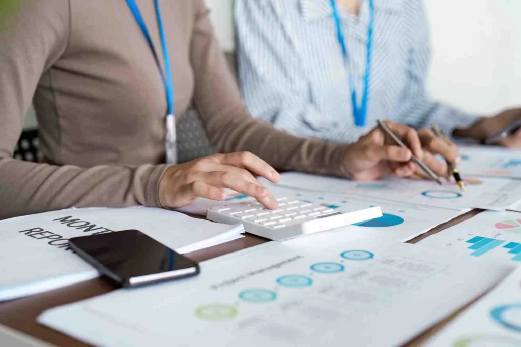 Management Accounts Services – business professionals reviewing monthly financial reports, cash flow analysis, KPI dashboards, and management accounts to improve profitability and business performance.