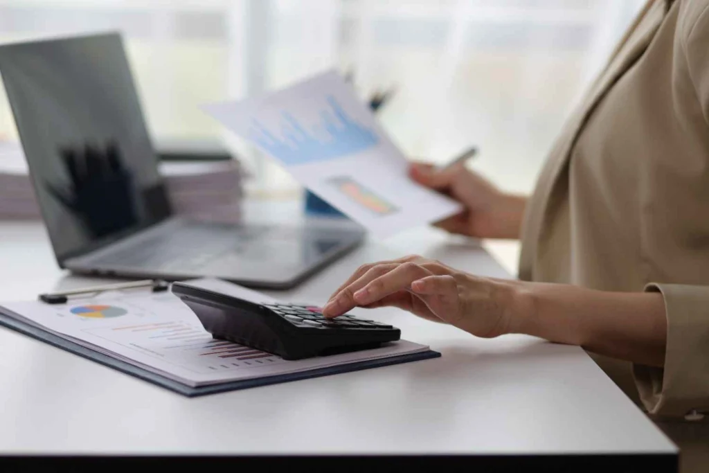 What is a Creditor in Accounting? Accountant reviewing financial documents and calculating accounts payable, creditor balances, and bookkeeping records for business accounting.